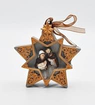 Dekorácia: hviezda s ornamentom a Svätou rodinou
